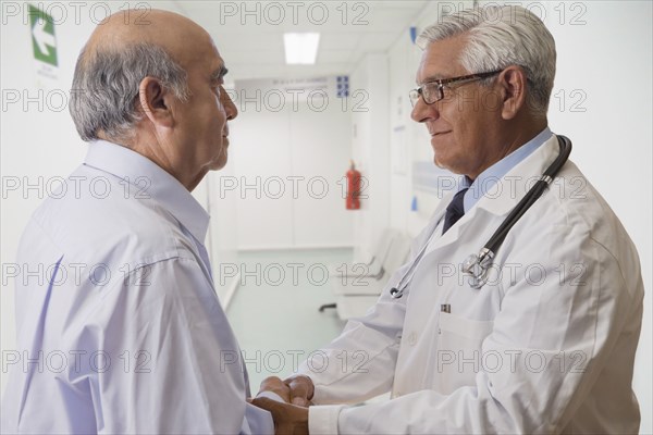 Hispanic doctor talking with patient