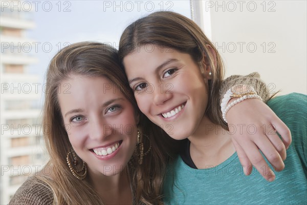 Hispanic women smiling together