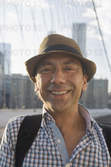 Close up portrait of smiling Hispanic man