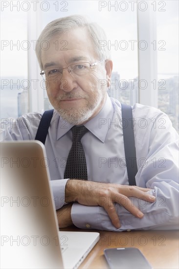 Hispanic businessman working at desk