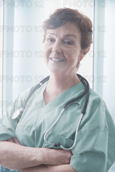 Hispanic doctor smiling in hospital