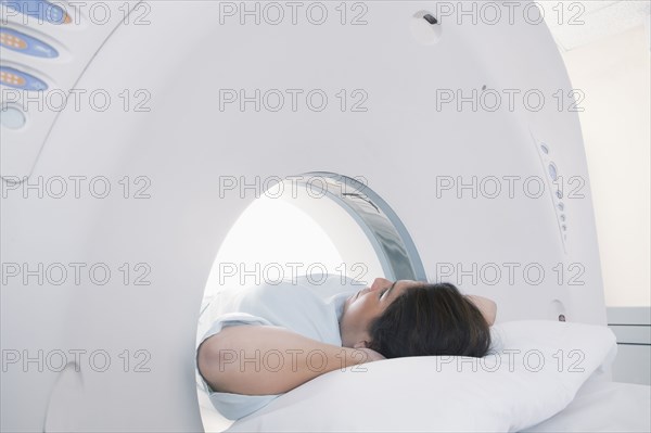 Hispanic patient laying in MRI machine