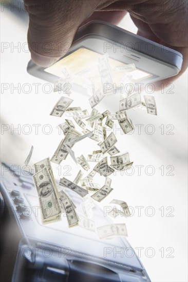 Hispanic man paying with smart phone