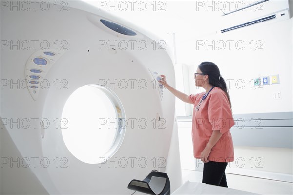 Hispanic nurse checking scanner