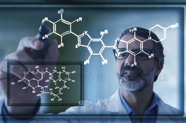 Hispanic scientist drawing chemical model on virtual screen