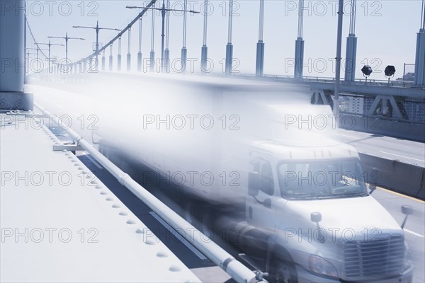 Semi-truck speeding on bridge