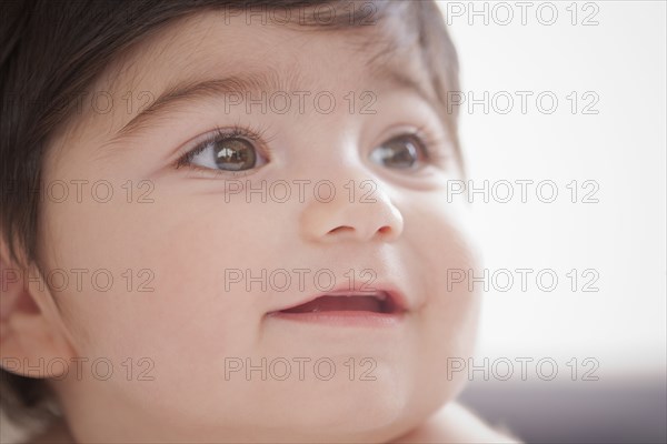 Portrait of smiling Hispanic baby boy