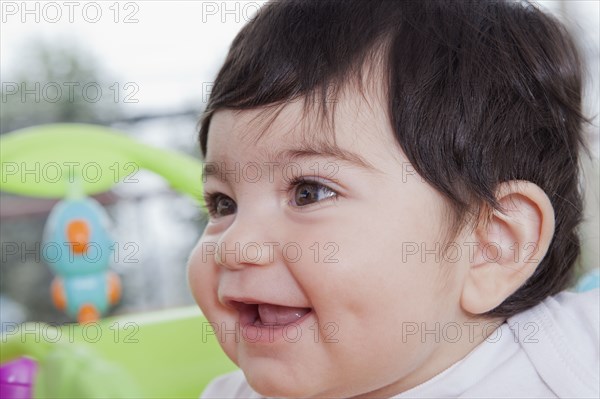 Smiling Hispanic baby boy