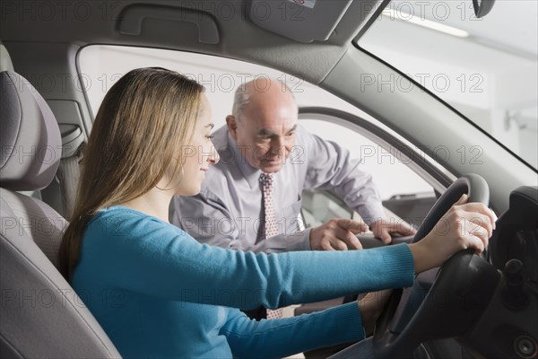 Hispanic woman shopping for new car