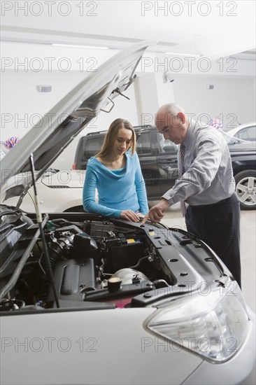 Hispanic woman shopping for new car