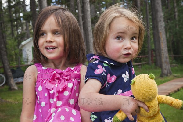 Girls standing together in forest