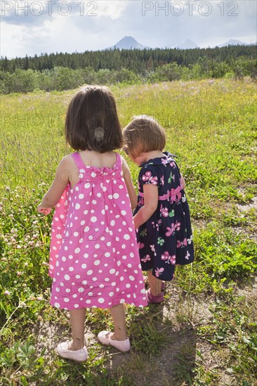 Girls walking together in field