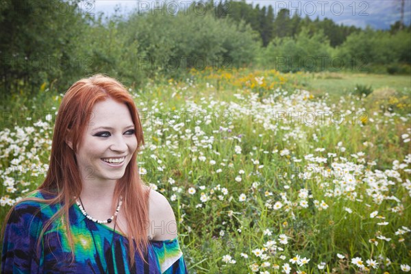 Caucasian woman standing in field