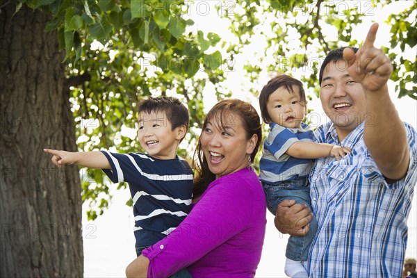 Japanese family playing in park