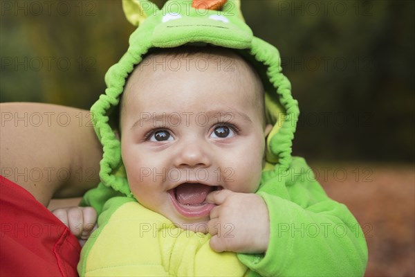 Smiling baby wearing costume