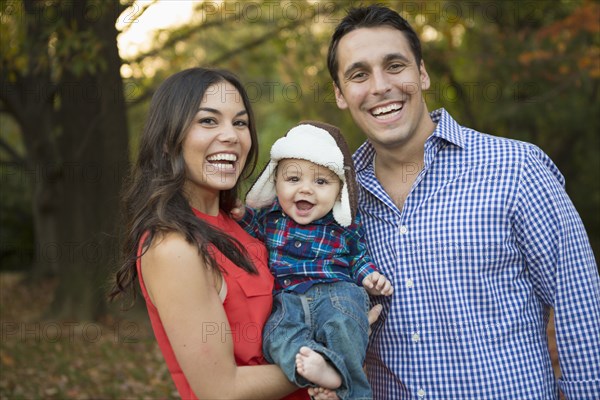 Family smiling together outdoors