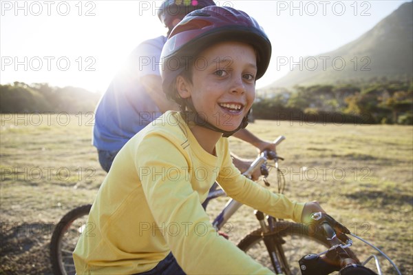 Caucasian father and son riding bicycles