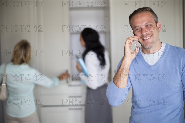 Man talking on cell phone in new home