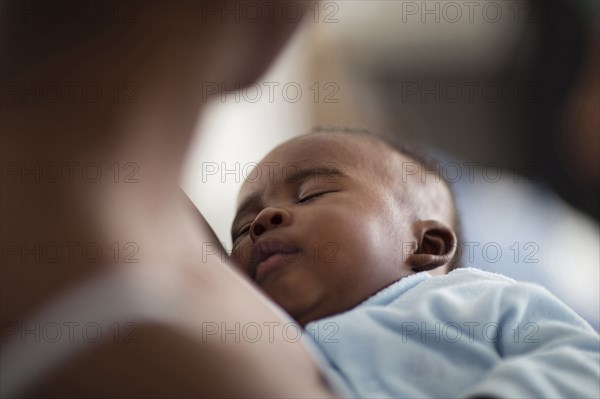 Close up of Black mother holding baby