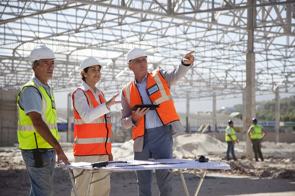 Architects talking at construction site