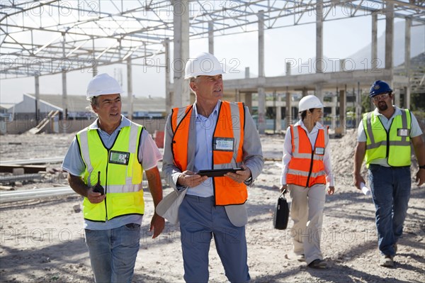 Architects talking at construction site
