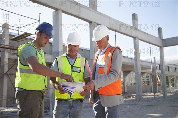 Architects talking at construction site