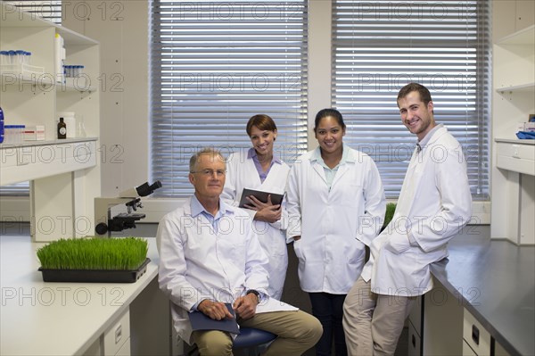 Scientists smiling in laboratory