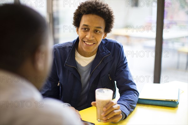 Men drinking coffee in cafe