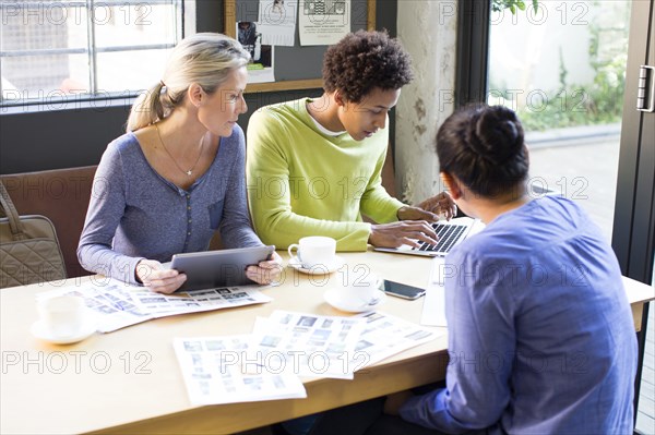 Business people using technology in office meeting