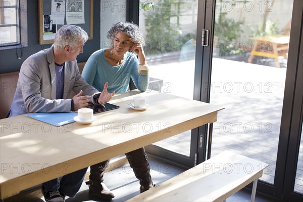 Business people talking in office meeting