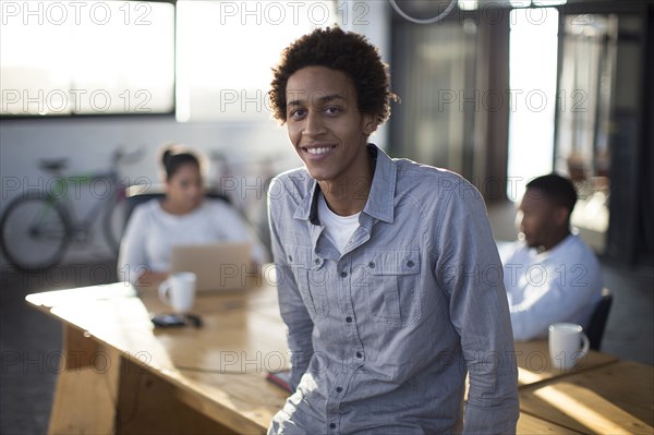 Businessman smiling in office