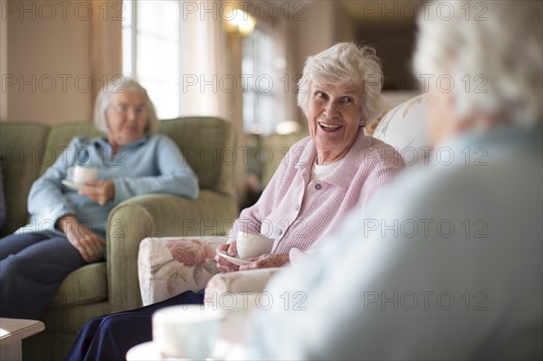 Older Caucasian women talking in nursing home