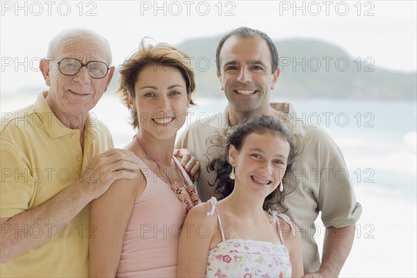 Family smiling outdoors