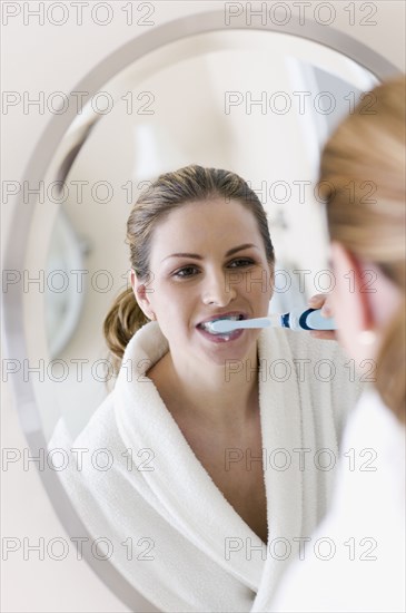 Hungarian woman brushing teeth