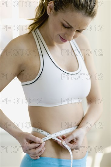 Hungarian woman measuring waist