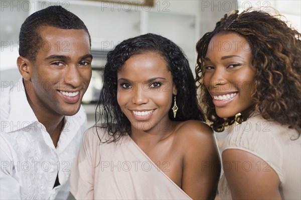 Multi-ethnic man and women smiling