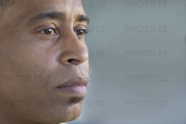 Close of up African man looking pensive