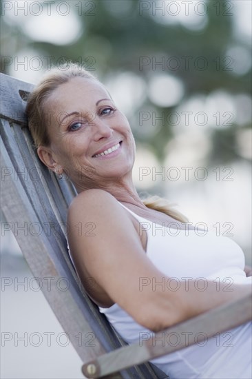 Brazilian woman sitting in lounge chair