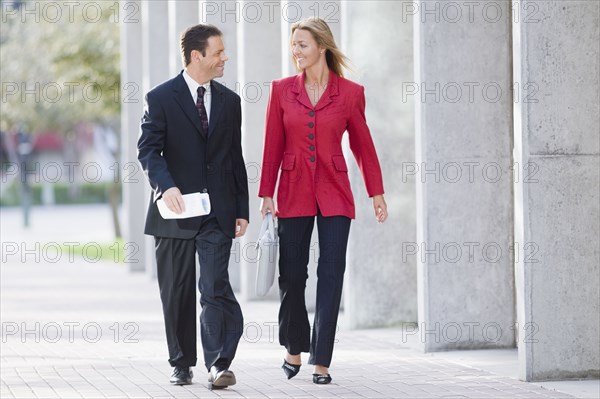 Businesspeople walking together outdoors