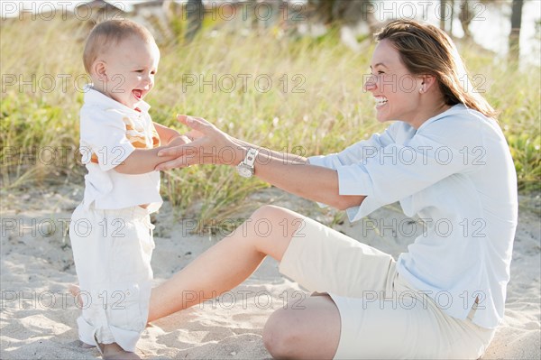 Mother and son enjoying the beach