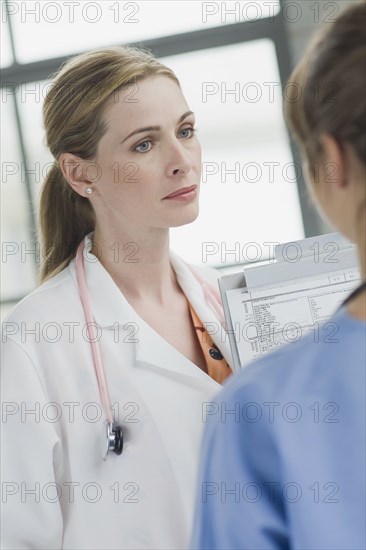 Doctors talking together in hospital