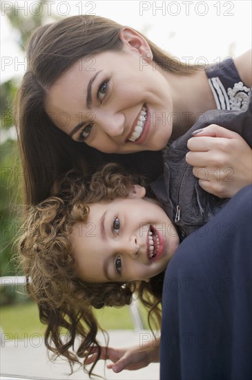 Smiling Hispanic woman with son