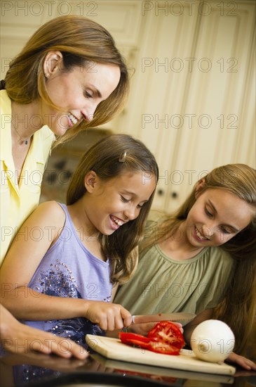 Hispanic family cooking together