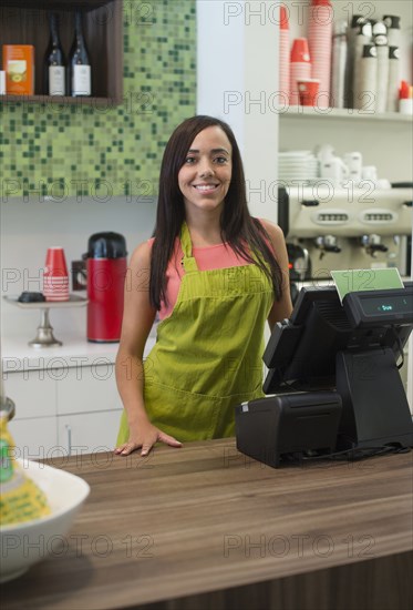 Mixed race business owner standing in shop