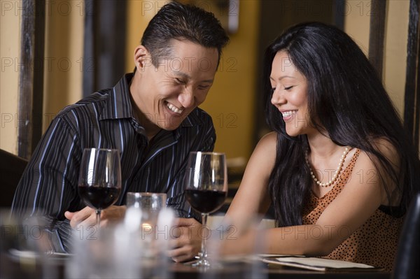 Couple having dinner together in restaurant