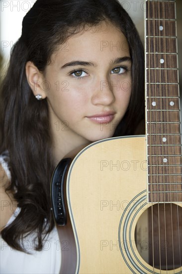 Colombian girl holding guitar