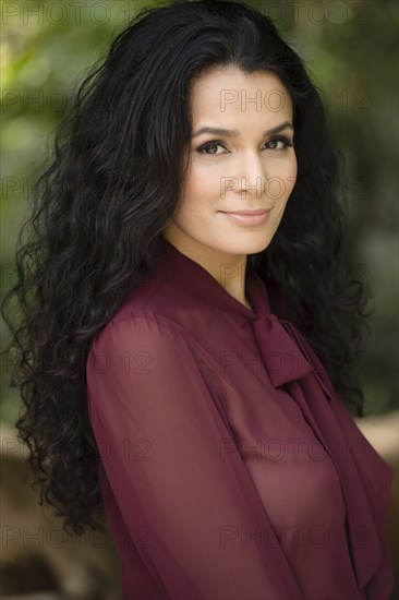 Hispanic woman smiling outdoors