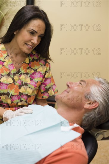 Nurse talking to dental patient