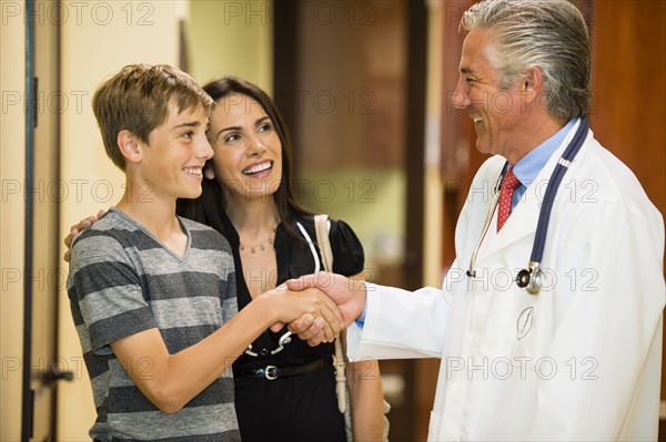 Patient shaking hands with dentist