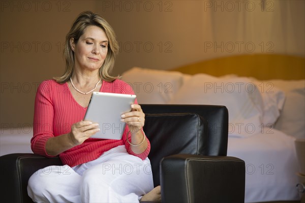 Caucasian woman using tablet computer